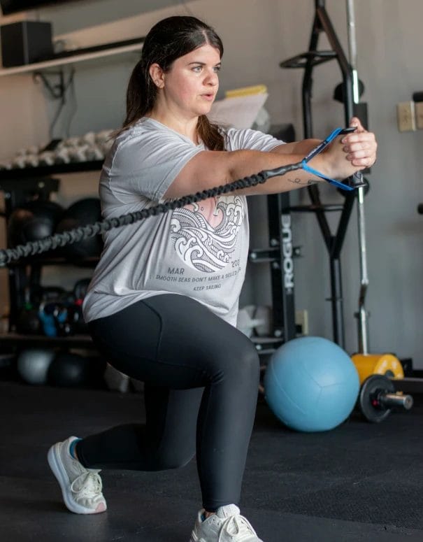 Lady stretching on training in Evolve Personal Fitness